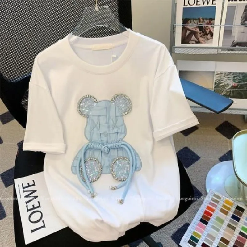 Women's White T-Shirt - Cute Blue Bear Embroidery with Rhinestone Accents, Luxury-Inspired Casual Summer Top for Trendy Outfits
Women's White T-Shirt - Cute Blue Bear Embroidery with Rhinestone Accents, Luxury-Inspired Casual Summer Top for Trendy Outfits