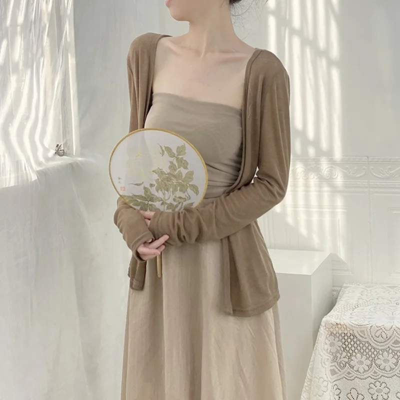 Thin Knitted Cardigan Women's Strap Dress Outer Cover Summer Sun Protection Shawl Small Cannon Ice Silk Coat
Thin Knitted Cardigan Women's Strap Dress Outer Cover Summer Sun Protection Shawl Small Cannon Ice Silk Coat