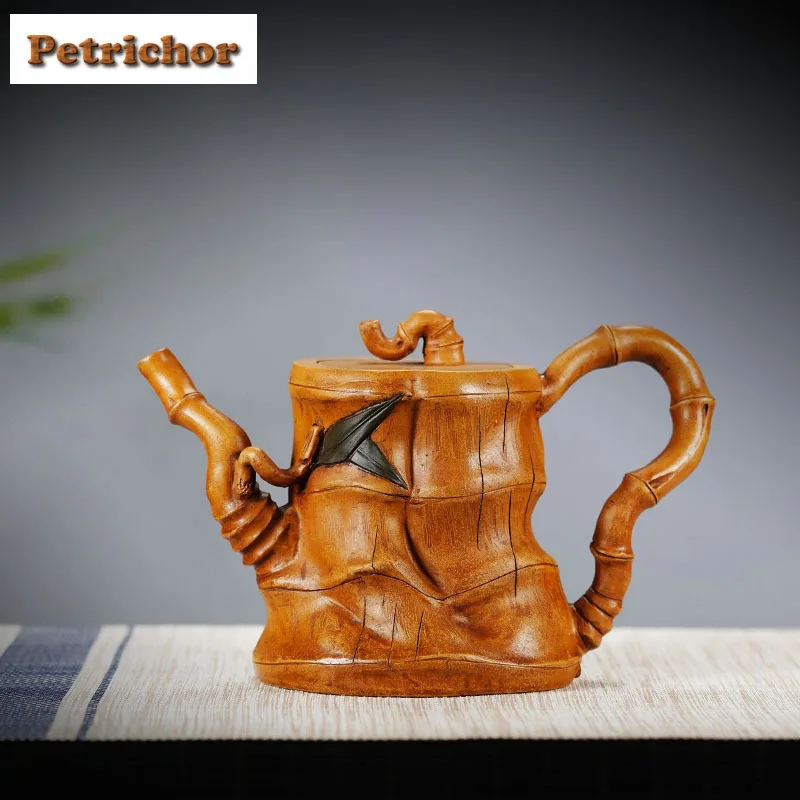 420ml Classic Yixing Purple Clay Teapots Artists Handmade Bamboo Joint Pot Raw Ore Section Mud Kettle Zisha Tea Set Drinkware
420ml Classic Yixing Purple Clay Teapots Artists Handmade Bamboo Joint Pot Raw Ore Section Mud Kettle Zisha Tea Set Drinkware