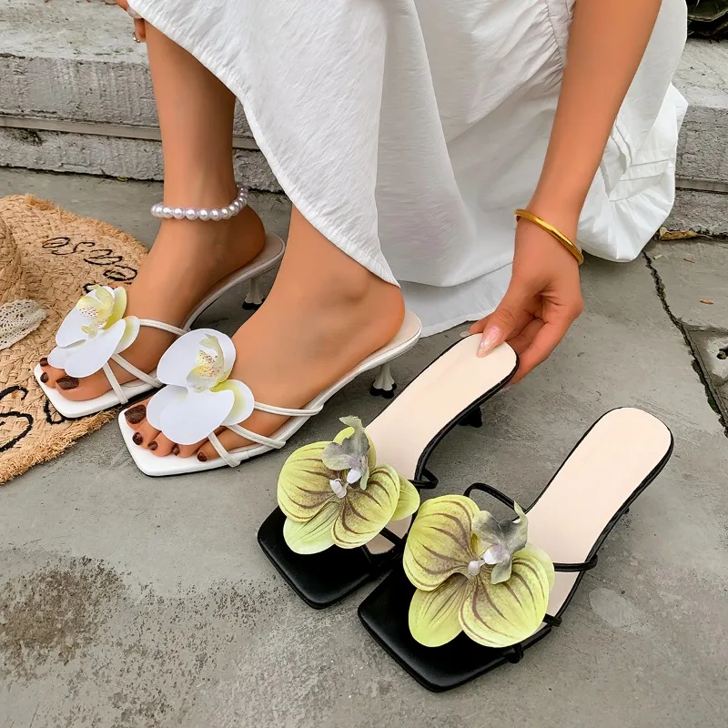Women 2026 New Elegant High Heel Slippers Summer Fashion Casual Outdoor Square Toe Sandals Trendy Flower Decorated Female Shoes
Women 2026 New Elegant High Heel Slippers Summer Fashion Casual Outdoor Square Toe Sandals Trendy Flower Decorated Female Shoes