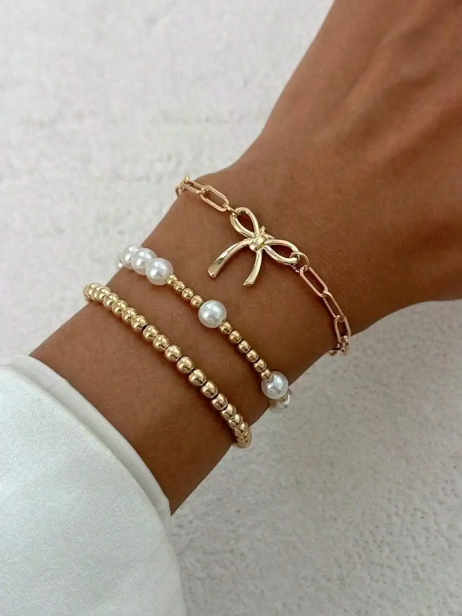 3-Piece Gold-Tone Bow Charm Pearl Bead Layered Bracelet Set For Women Elegant Daily Wear Gift
3-Piece Gold-Tone Bow Charm Pearl Bead Layered Bracelet Set For Women Elegant Daily Wear Gift
