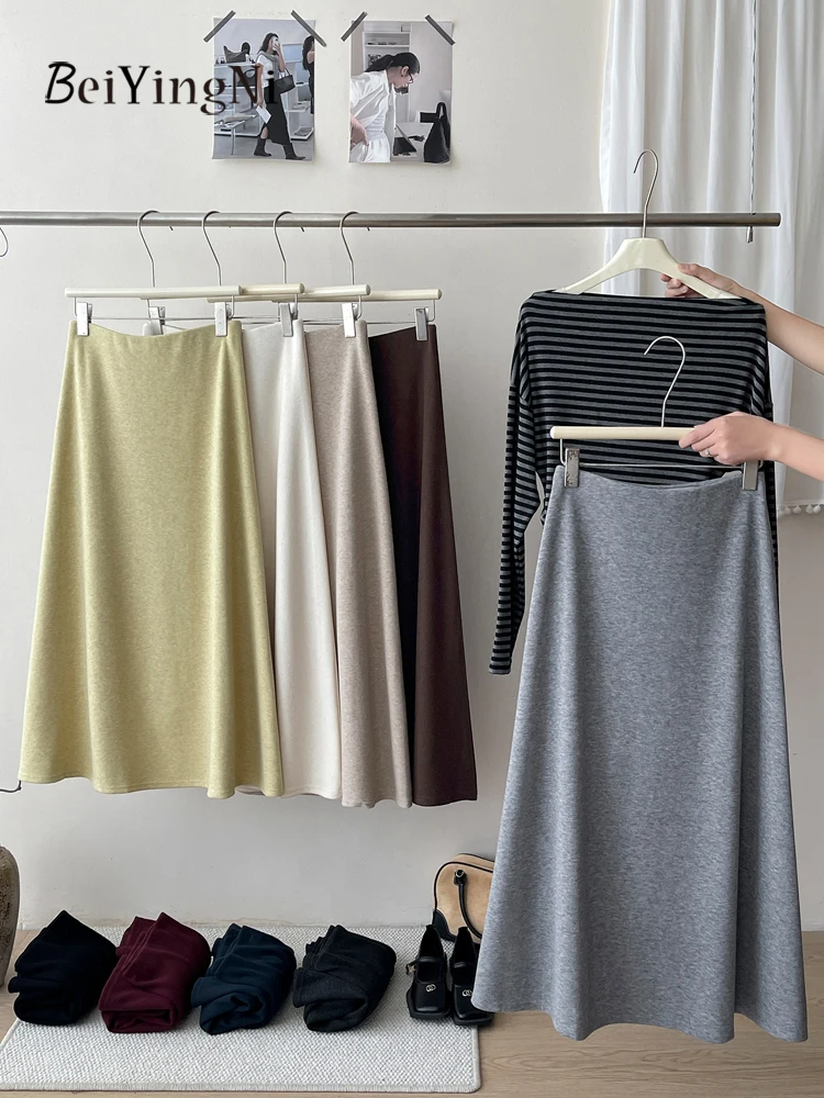 Beiyingni, осенне-зимние женские шерстяные утепленные юбки трапециевидной формы, однотонные кашемировые французские элегантные женские юбки-миди, повседневные Jupes 2025
Beiyingni, осенне-зимние женские шерстяные утепленные юбки трапециевидной формы, однотонные кашемировые французские элегантные женские юбки-миди, повседневные Jupes 2025
