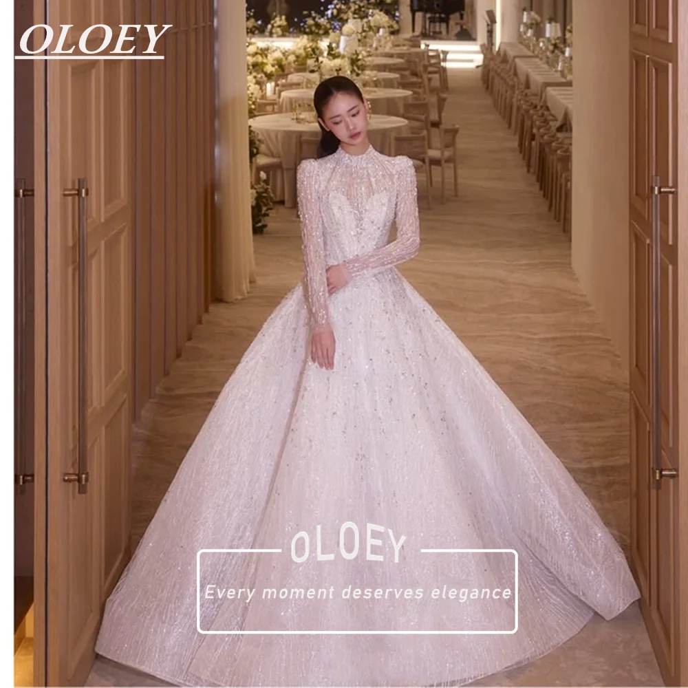 Роскошное свадебное платье OLOEY с бисером и блестками, с длинными рукавами, А-силуэт, бальное платье для невесты, на заказ, со шлейфом, Robe De Mariage
Роскошное свадебное платье OLOEY с бисером и блестками, с длинными рукавами, А-силуэт, бальное платье для невесты, на заказ, со шлейфом, Robe De Mariage