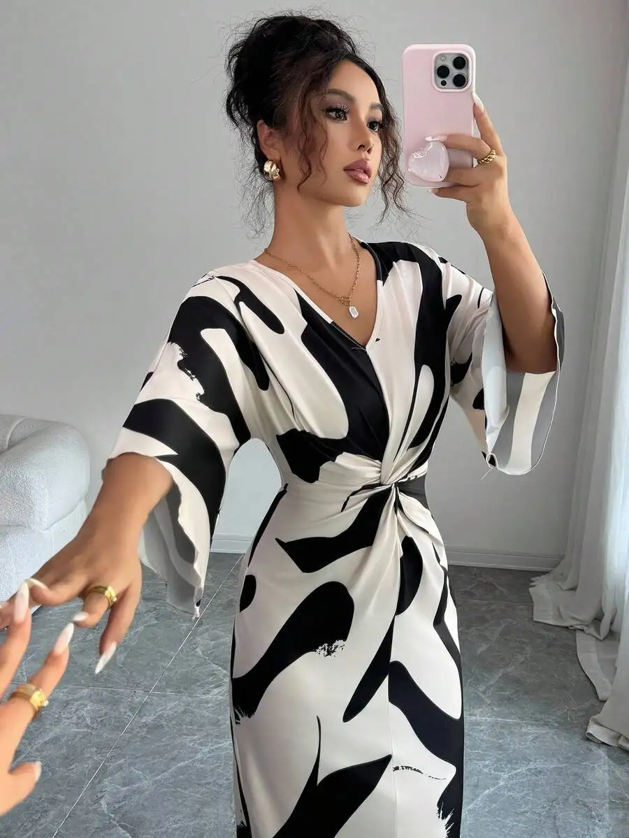 Black and White Abstract Print V-Neck Twist Waist Midi Dress with Flared Sleeves
Black and White Abstract Print V-Neck Twist Waist Midi Dress with Flared Sleeves