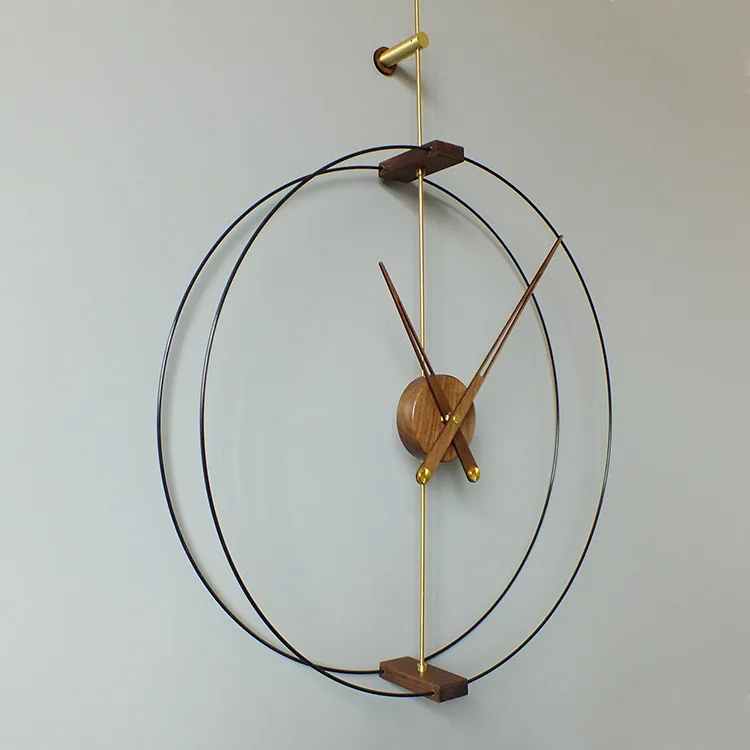 Nordic modern minimalist creative Spanish nomon wall clock hotel living room black walnut large pointer copper wall decoration
Nordic modern minimalist creative Spanish nomon wall clock hotel living room black walnut large pointer copper wall decoration