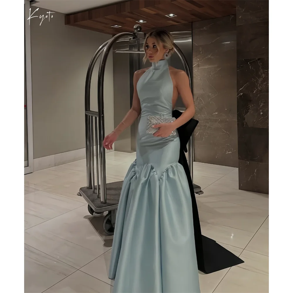 Kyoto Blue Halter Neck Bow Prom Dresses Sleeveless A-line Customized جديد في الفساتين Backless Floor-Length Evening Dress 2025
Kyoto Blue Halter Neck Bow Prom Dresses Sleeveless A-line Customized جديد في الفساتين Backless Floor-Length Evening Dress 2025