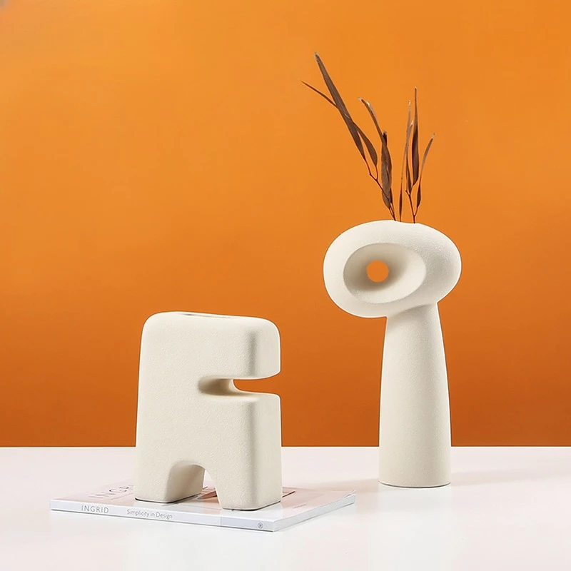 Nordic minimalist style abstract new and peculiar ceramic small vase, model house, desktop creative ornament
Nordic minimalist style abstract new and peculiar ceramic small vase, model house, desktop creative ornament