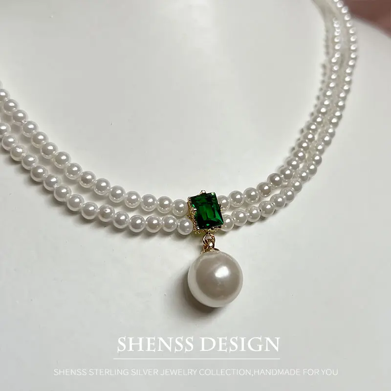 Elegant imitation pearl double-layer neck chain with green zircon pendant for women
Elegant imitation pearl double-layer neck chain with green zircon pendant for women