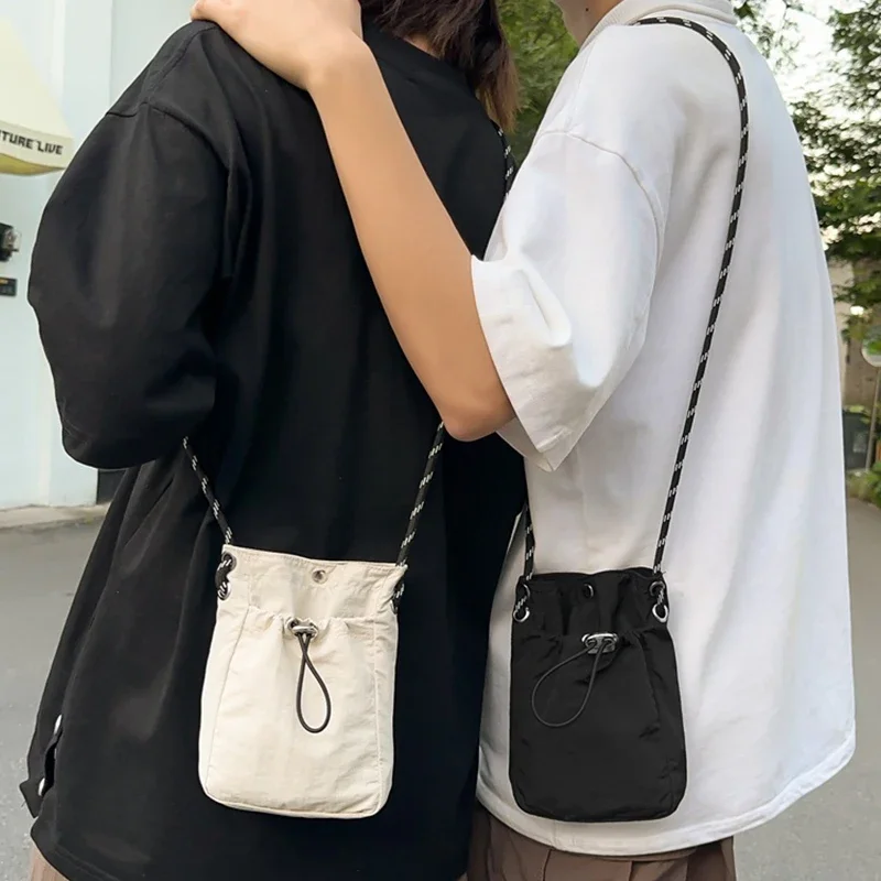 Korean Fashion Mini Nylon Shoulder Bag For Men Women Chic Crossbody Bucket Bag Casual Small Handbag Drawstring Purse Phone Pouch
Korean Fashion Mini Nylon Shoulder Bag For Men Women Chic Crossbody Bucket Bag Casual Small Handbag Drawstring Purse Phone Pouch