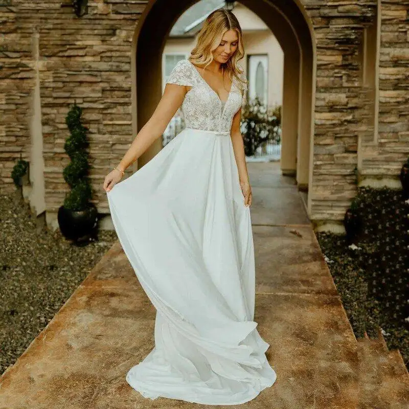 Bohemian A-Line Wedding Dresses White V-Neck Cap Sleeve Lace Applique Chiffon Backless Bridal Gown Sweep Train Vestidos De Novia
Bohemian A-Line Wedding Dresses White V-Neck Cap Sleeve Lace Applique Chiffon Backless Bridal Gown Sweep Train Vestidos De Novia