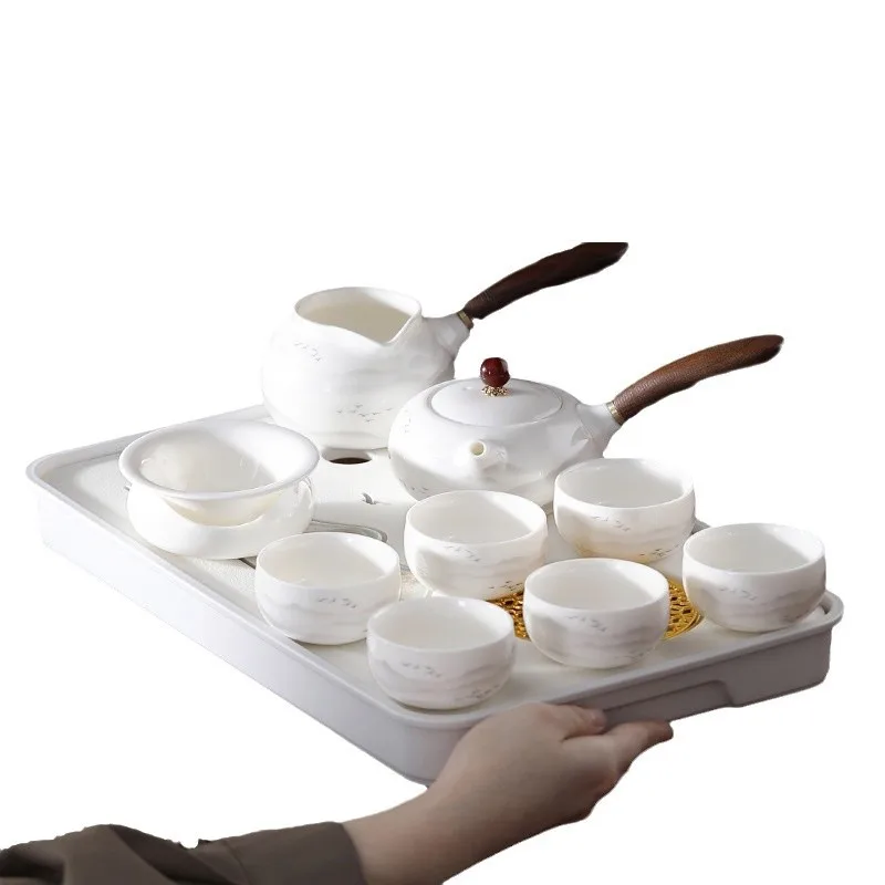 Suet jade tea set Household brewing teapot set White porcelain teapot Kung Fu tea sets Gift box sets
Suet jade tea set Household brewing teapot set White porcelain teapot Kung Fu tea sets Gift box sets