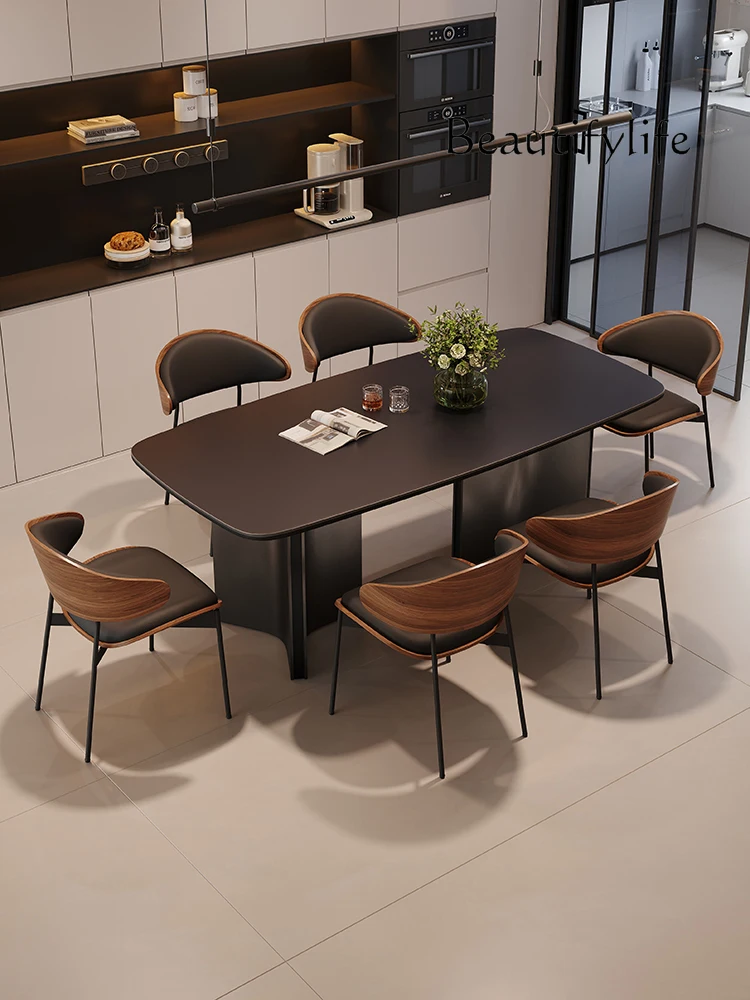 Italian simple modern black rock slab dining table and chair combination rectangular table retro small apartment
Italian simple modern black rock slab dining table and chair combination rectangular table retro small apartment