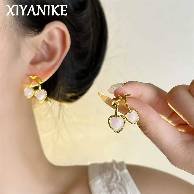XIYANIKE Cute Moonstone Cherry Heart Stud Piercing Earrings For Women Fashion New Jewelry Accessories Gift Party Dropshipping 
XIYANIKE Cute Moonstone Cherry Heart Stud Piercing Earrings For Women Fashion New Jewelry Accessories Gift Party Dropshipping