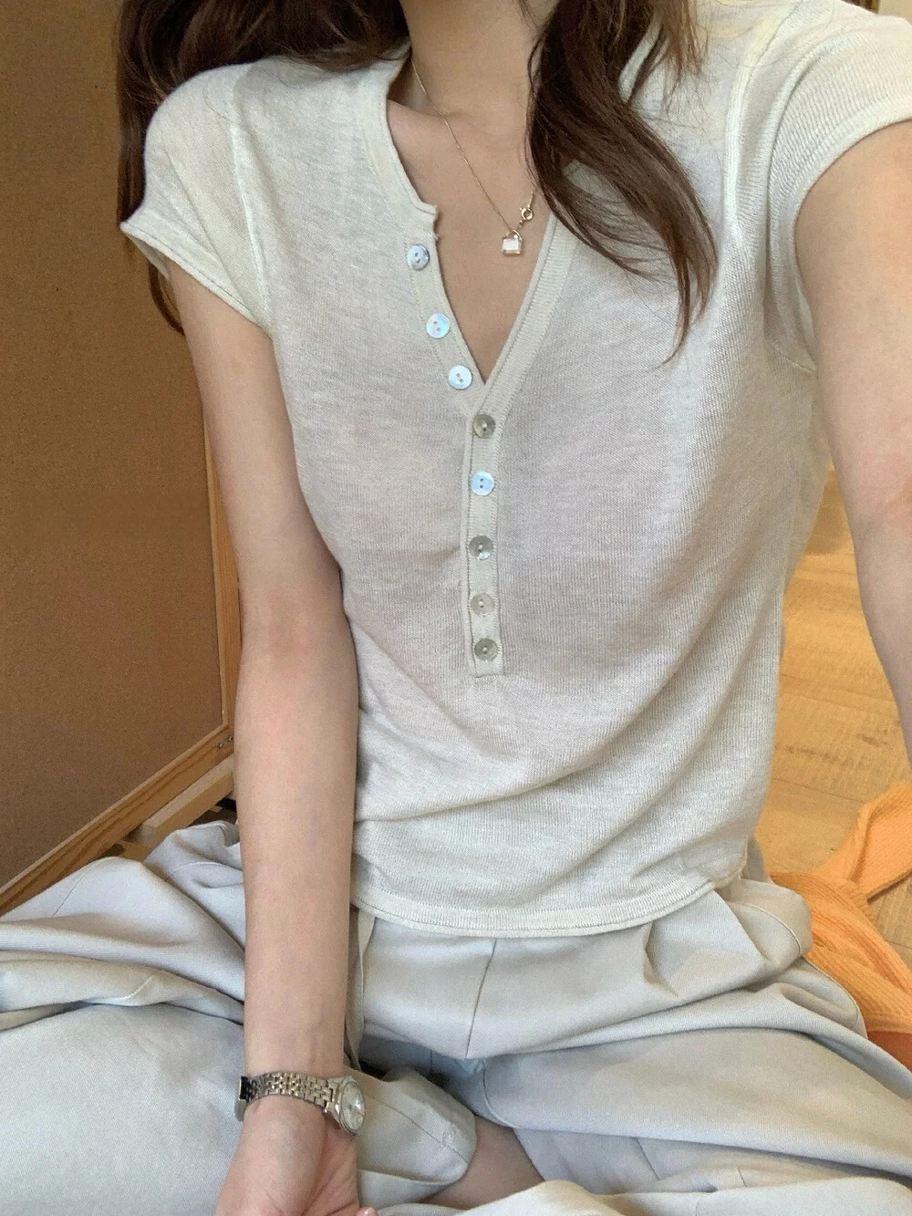 Slim Fit V-Neck Knitted Top with Buttons Short Sleeve Korean Style Half Open Design Fashionable And Age-Defying Women's Shirt
Slim Fit V-Neck Knitted Top with Buttons Short Sleeve Korean Style Half Open Design Fashionable And Age-Defying Women's Shirt