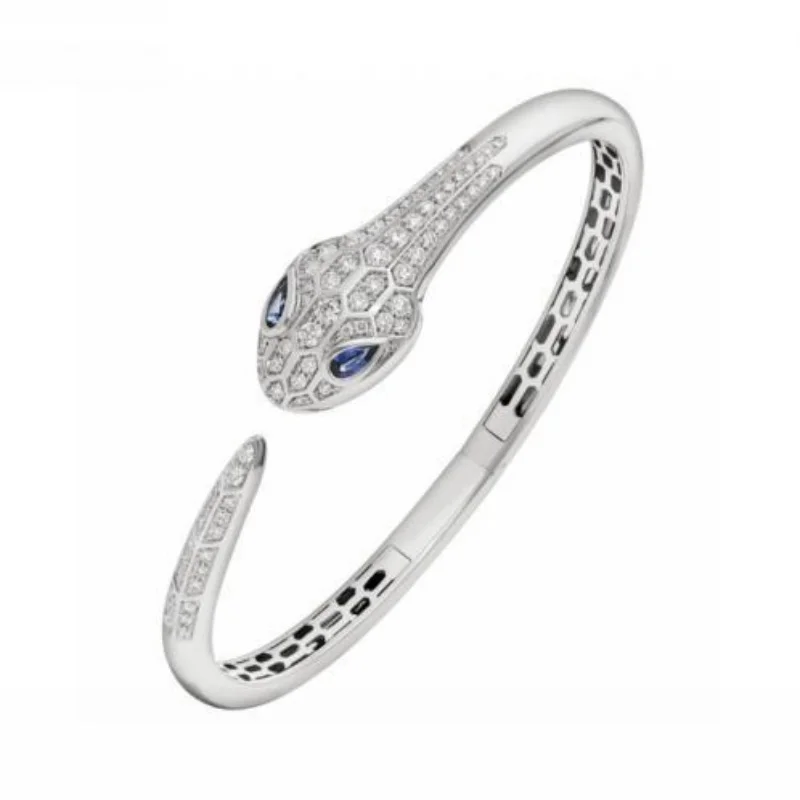 White Gold Cuff Bracelet with Diamond Snake Head & Blue Sapphire Eyes
White Gold Cuff Bracelet with Diamond Snake Head & Blue Sapphire Eyes