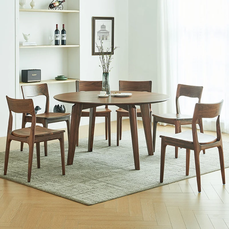 North American black walnut dining table all solid wood modern household large round dining table small apartment European
North American black walnut dining table all solid wood modern household large round dining table small apartment European