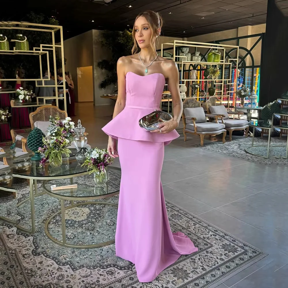 Custom pink floor-length gown with cinched waist and subtle train, sleek fit and elegant design suit all formal occasions.
Custom pink floor-length gown with cinched waist and subtle train, sleek fit and elegant design suit all formal occasions.