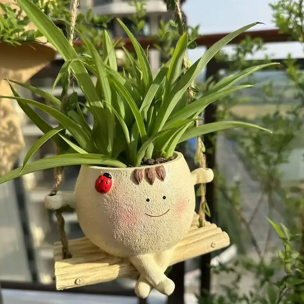 Creative smile hanging chair flower pot garden courtyard decoration resin statue ornament small succulent plant flower pot
Creative smile hanging chair flower pot garden courtyard decoration resin statue ornament small succulent plant flower pot