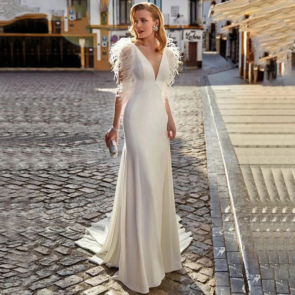Elegant Deep V-Neck Mermaid Wedding Dress Sleeveless with Feathers Chic Illusion Tulle Applique Back Sweep Train Bride Gowns
Elegant Deep V-Neck Mermaid Wedding Dress Sleeveless with Feathers Chic Illusion Tulle Applique Back Sweep Train Bride Gowns