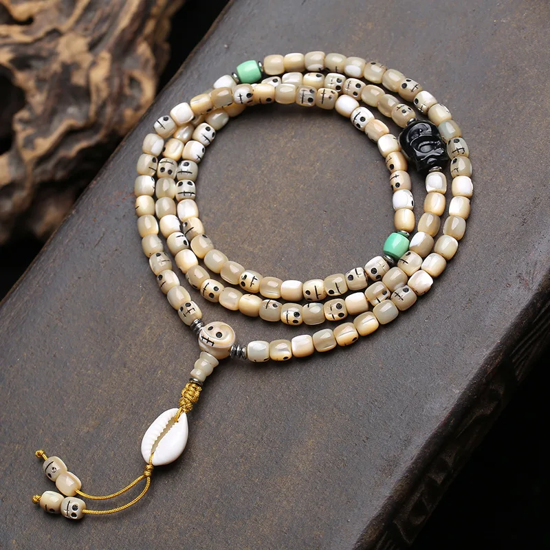 Tibetan-style antique fishbone carving“A Dai”108-bead multi-strand bracelet withChitralin shell beads for handling and polishing
Tibetan-style antique fishbone carving“A Dai”108-bead multi-strand bracelet withChitralin shell beads for handling and polishing