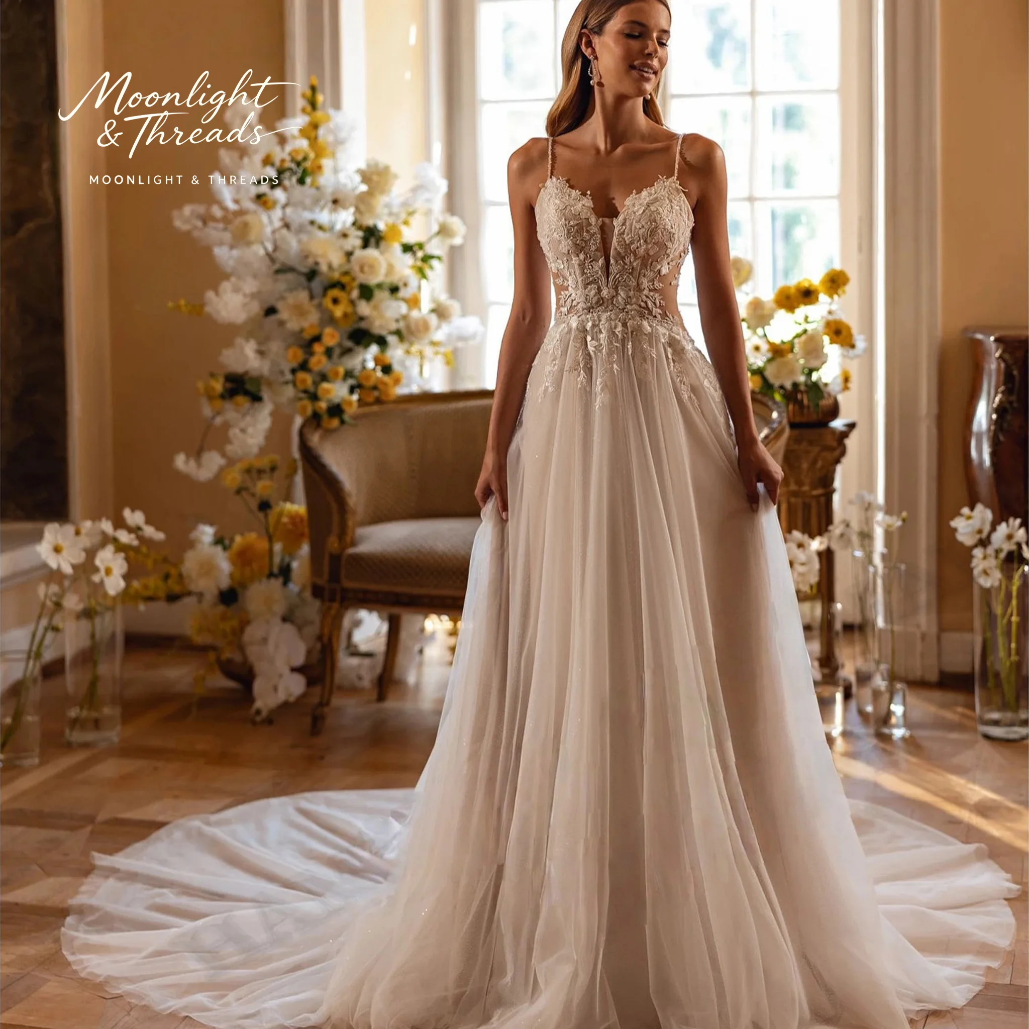Ivory lace floor-length formal wedding gown featuring a strapless bodice full skirt and intricate cut-out embroidery
Ivory lace floor-length formal wedding gown featuring a strapless bodice full skirt and intricate cut-out embroidery