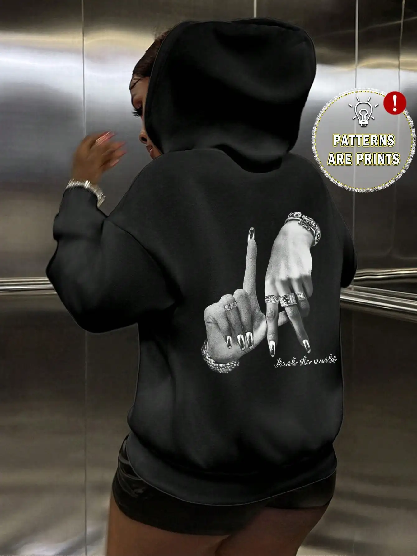 Black Oversized Hoodie with Graphic Hand Print and 'Rock the World' Text
Black Oversized Hoodie with Graphic Hand Print and 'Rock the World' Text