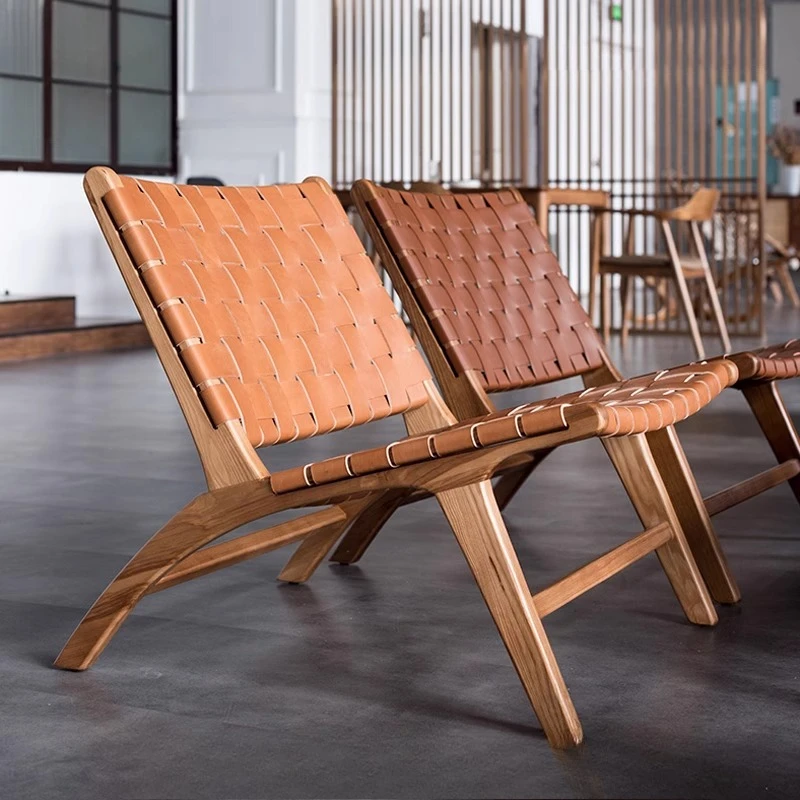 Nordic ins designer sofa chair saddle leather woven living room solid wood backrest simple recliner balcony home single
Nordic ins designer sofa chair saddle leather woven living room solid wood backrest simple recliner balcony home single