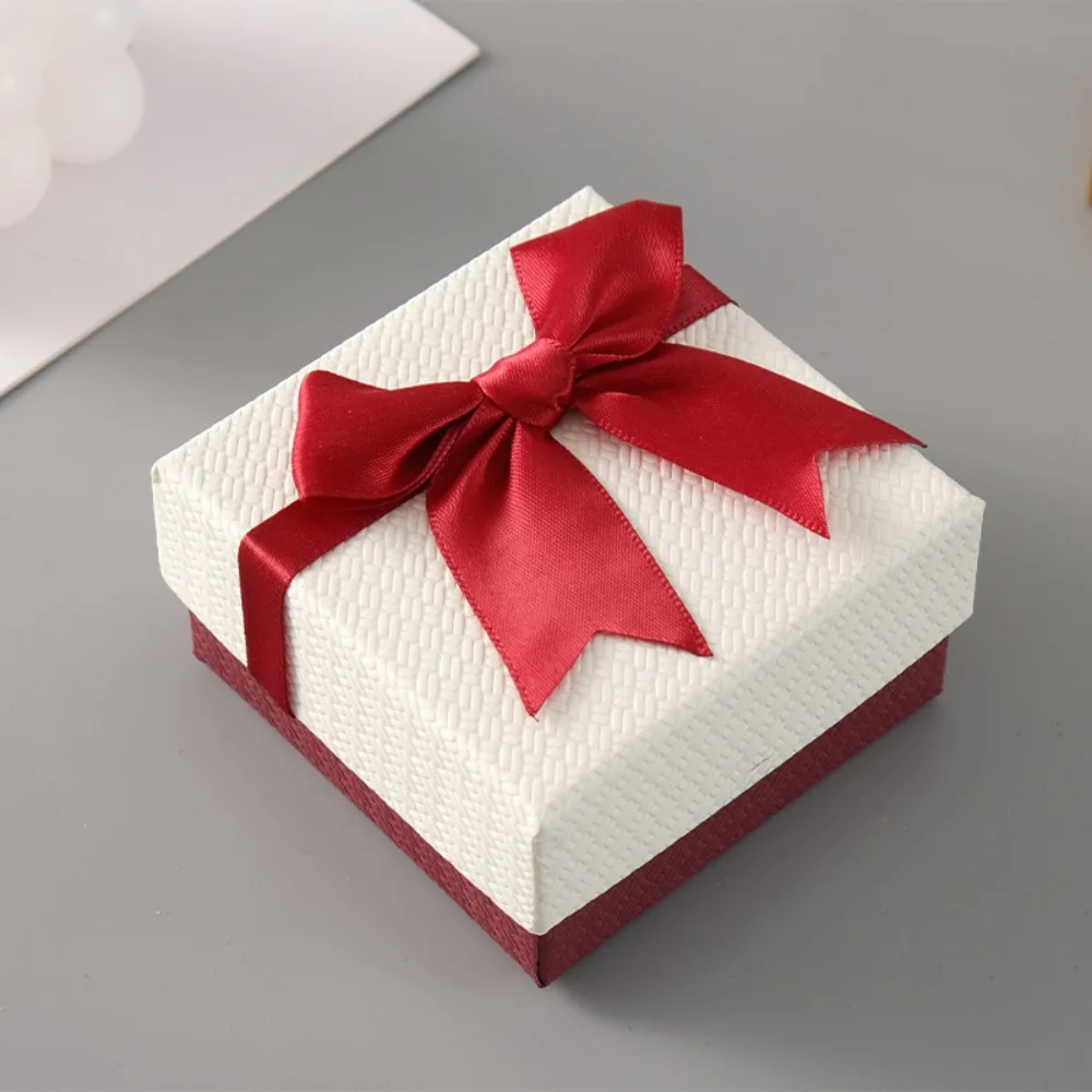 Portable 9*9*4cm Jewelry Packaging Box Bow Design Paper Material Jewelry Display Box Texture Square Ring Box Gift-giving
Portable 9*9*4cm Jewelry Packaging Box Bow Design Paper Material Jewelry Display Box Texture Square Ring Box Gift-giving