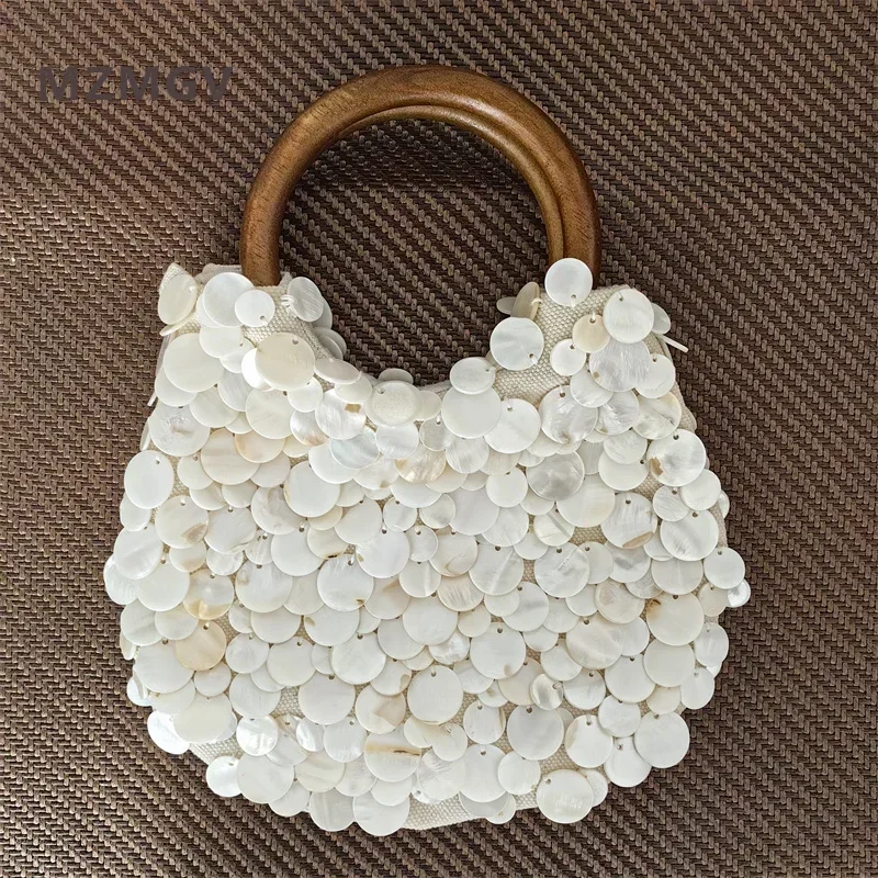 High Quality Handmade Natural Shell Woven Handbag Luxurious Design Women's Circular Wooden Handle Summer Beach Tote Bag 2025
High Quality Handmade Natural Shell Woven Handbag Luxurious Design Women's Circular Wooden Handle Summer Beach Tote Bag 2025