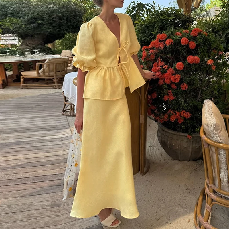 Elegant High Waist Holiday Outfit 2025 New Women's V Neck Lace Up Top + Long Skirt Suit Sweet Casual Puff Sleeves Two Piece Set
Elegant High Waist Holiday Outfit 2025 New Women's V Neck Lace Up Top + Long Skirt Suit Sweet Casual Puff Sleeves Two Piece Set