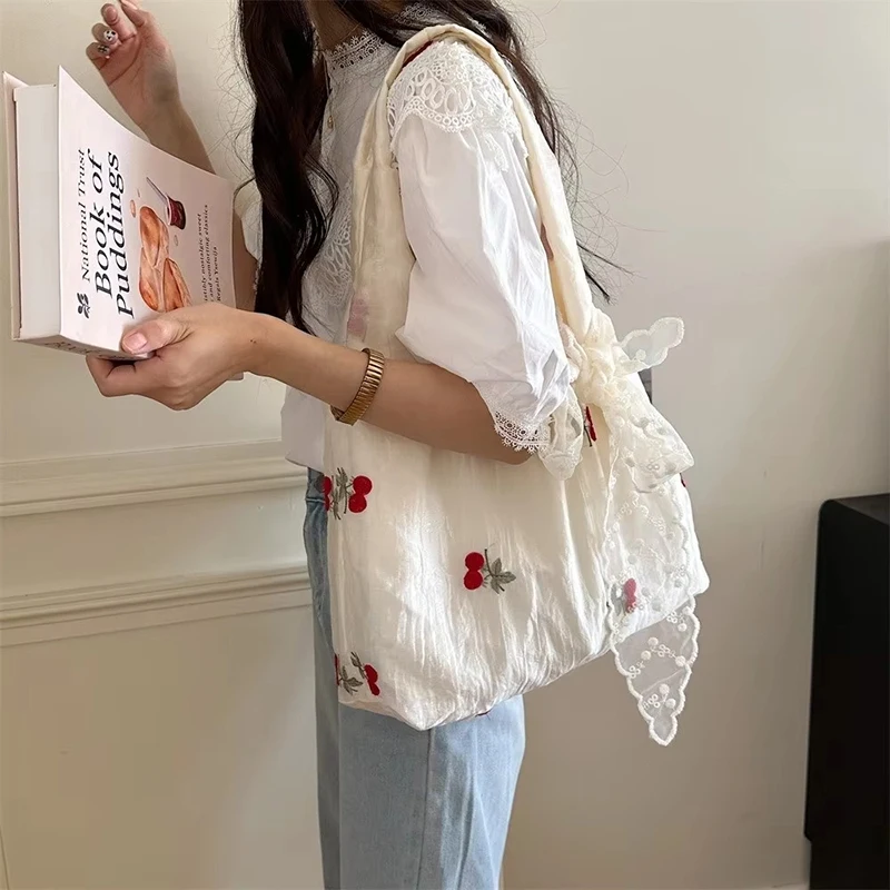 Simple Embroidered Bow Tote Bag Chiffon Solid Color Cherry Shoulder Bag Light Weight Korean Style Canvas Underarm Bag Handbag
Simple Embroidered Bow Tote Bag Chiffon Solid Color Cherry Shoulder Bag Light Weight Korean Style Canvas Underarm Bag Handbag
