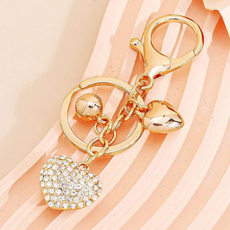 Golden full-diamond heart keychain, luxurious love style, brilliant heart-shaped pendant bag charm
Golden full-diamond heart keychain, luxurious love style, brilliant heart-shaped pendant bag charm