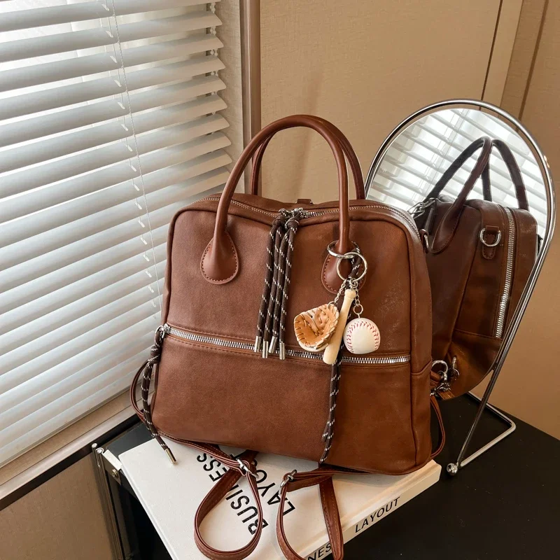 Autumn and Winter Retro College Style Handbag for Women New Fashion Versatile Niche Design College Student Backpack Tragetasche
Autumn and Winter Retro College Style Handbag for Women New Fashion Versatile Niche Design College Student Backpack Tragetasche