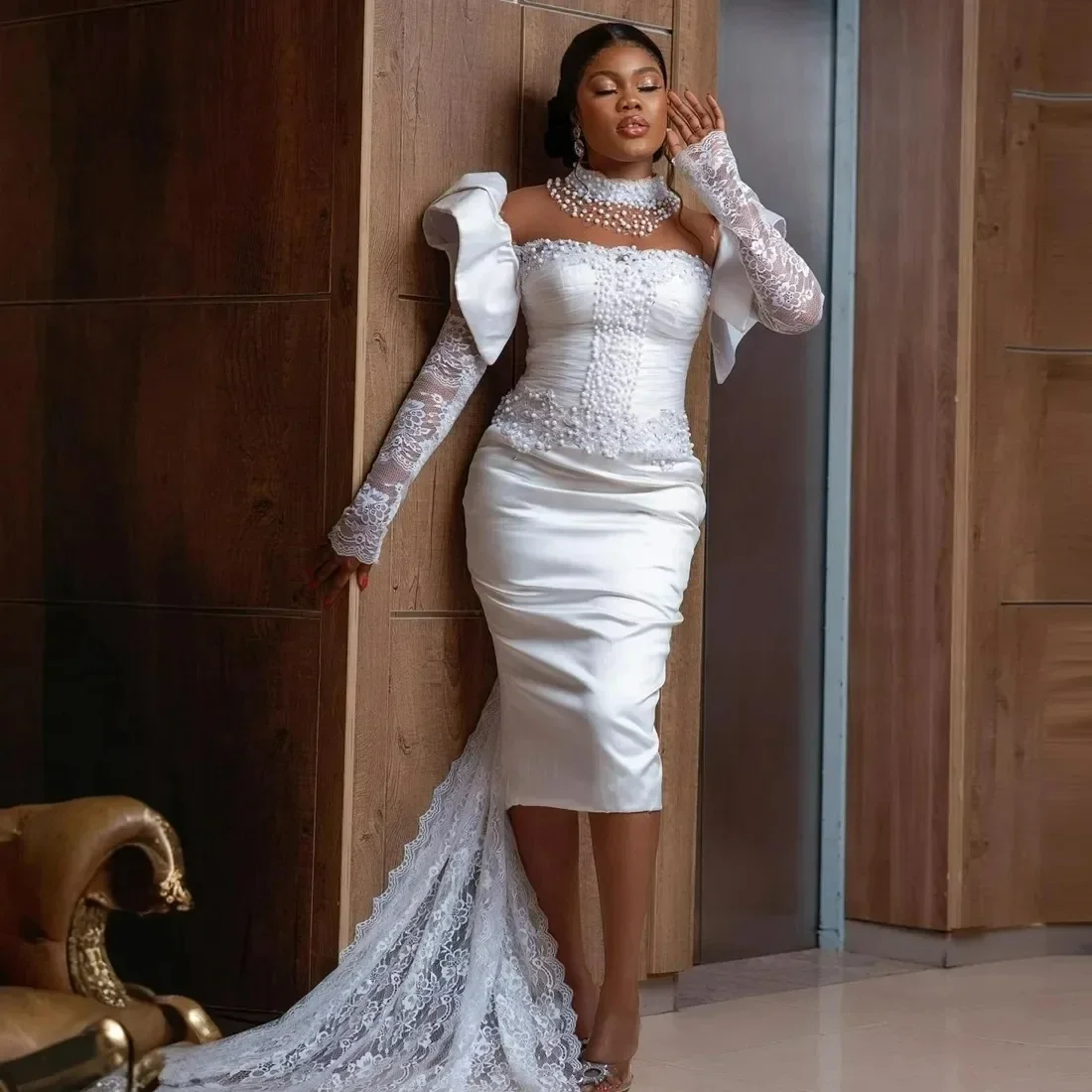 Customized African Sparkly Pearls High Collar Sheath Wedding Dresses Robe De Mariée Lace Full Sleeves Illusion Back Bridal Gown
Customized African Sparkly Pearls High Collar Sheath Wedding Dresses Robe De Mariée Lace Full Sleeves Illusion Back Bridal Gown
