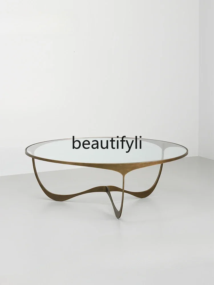 A Simple fiberglass coffee table serpentine round table villa light luxury metal coffee table
A Simple fiberglass coffee table serpentine round table villa light luxury metal coffee table