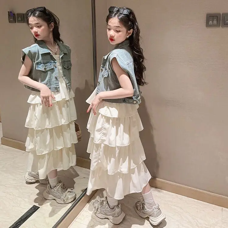 Girls' summer set 2026 Korean style dress, mid size children's camisole, cake skirt, denim vest
Girls' summer set 2026 Korean style dress, mid size children's camisole, cake skirt, denim vest