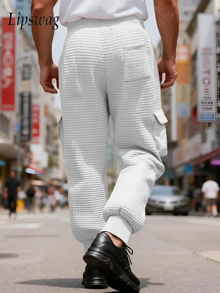 Outdoor Casual Waffle Plaid Cargo Pants Men 2026 Spring Sports Sweatpants Mens Stylish Solid Color Drawstring Multi Pocket Pant
Outdoor Casual Waffle Plaid Cargo Pants Men 2026 Spring Sports Sweatpants Mens Stylish Solid Color Drawstring Multi Pocket Pant