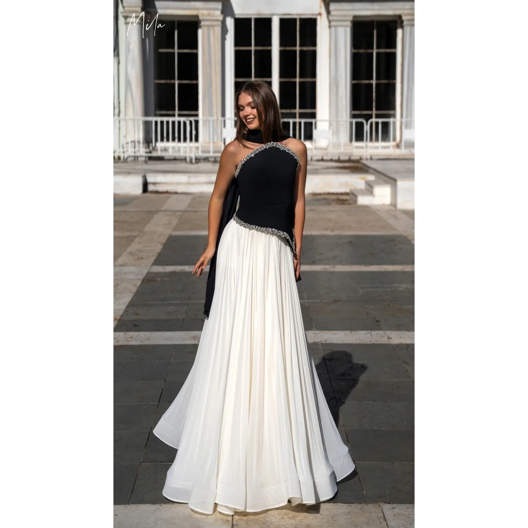 Bella Customized Black and White One Shoulder Prom Dress with Beaded Trim and Flowing Pleated Chiffon Elegant Robes de soiée
Bella Customized Black and White One Shoulder Prom Dress with Beaded Trim and Flowing Pleated Chiffon Elegant Robes de soiée