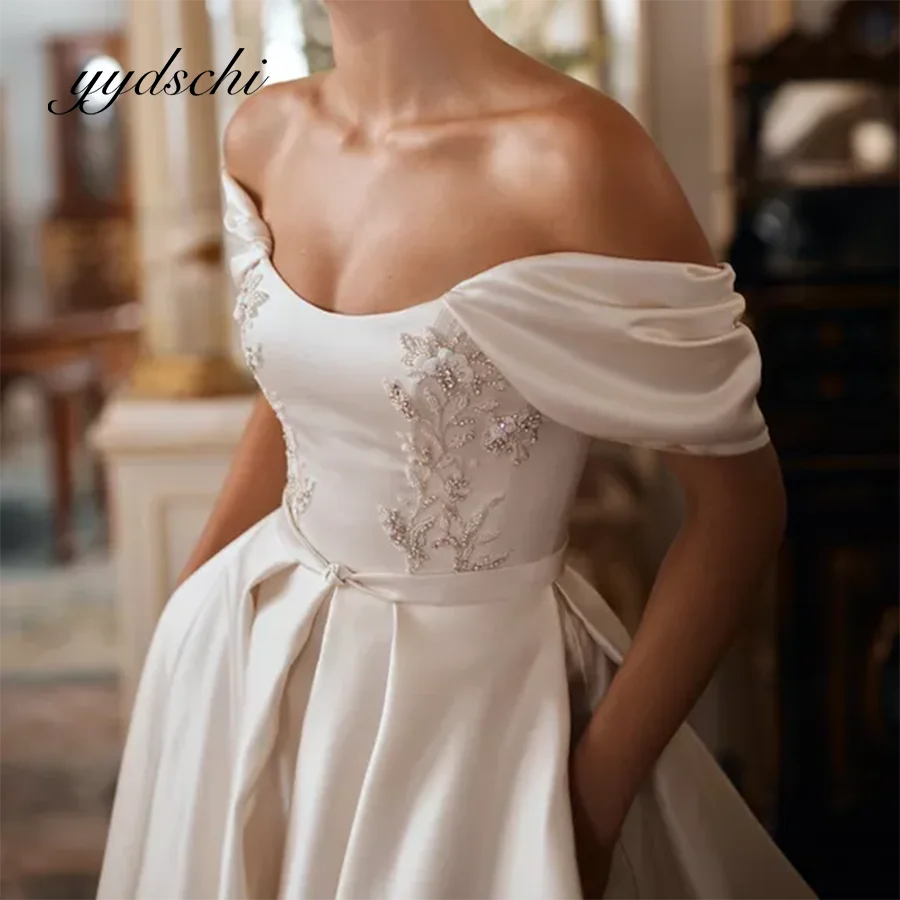 Off the Shoulder Wedding Dress Satin Applique Beading Embroidery Floor Length Sexy A-Line Bridal Court Train Dresses 2025 Simple
Off the Shoulder Wedding Dress Satin Applique Beading Embroidery Floor Length Sexy A-Line Bridal Court Train Dresses 2025 Simple