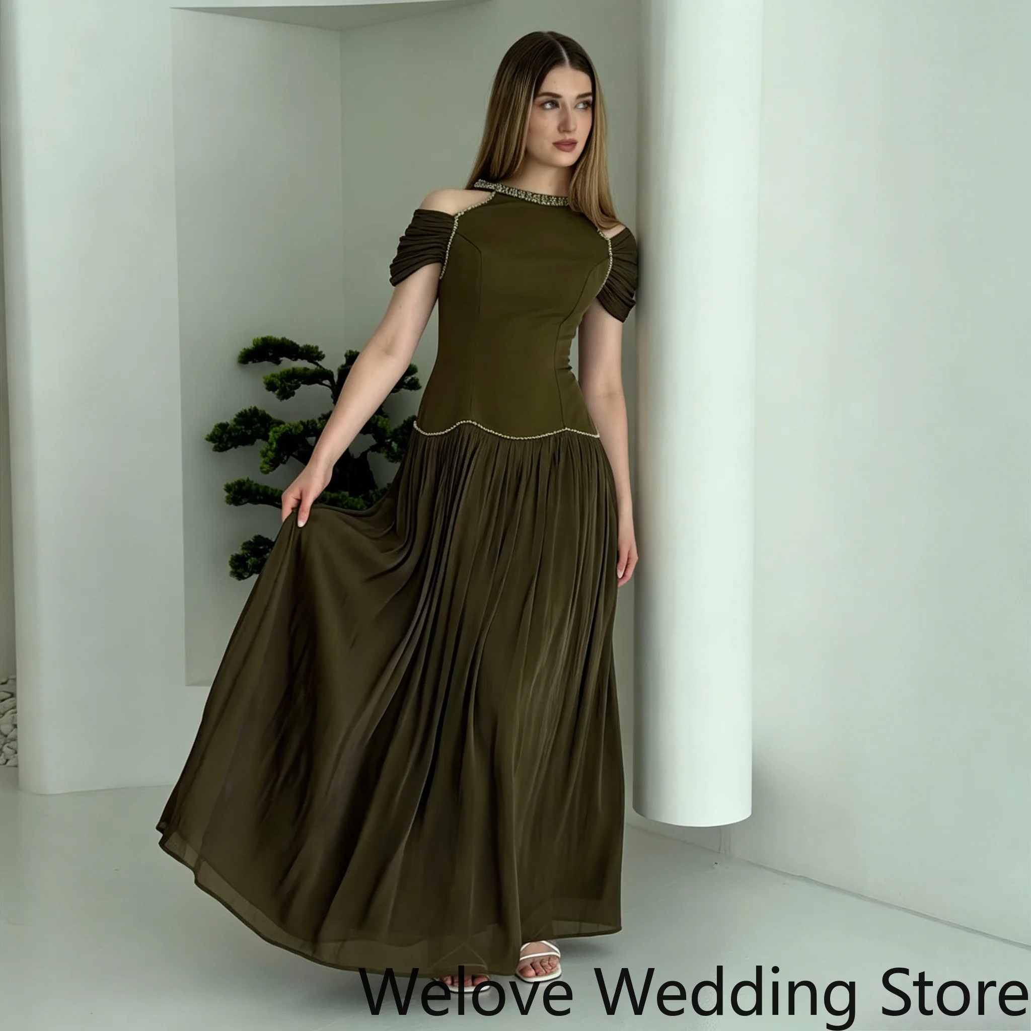Customized Elegant Olive Green Maxi Dress Featuring a Cold Shoulder Neckline, Short Ruched Sleeves and Delicate Beaded Trim
Customized Elegant Olive Green Maxi Dress Featuring a Cold Shoulder Neckline, Short Ruched Sleeves and Delicate Beaded Trim