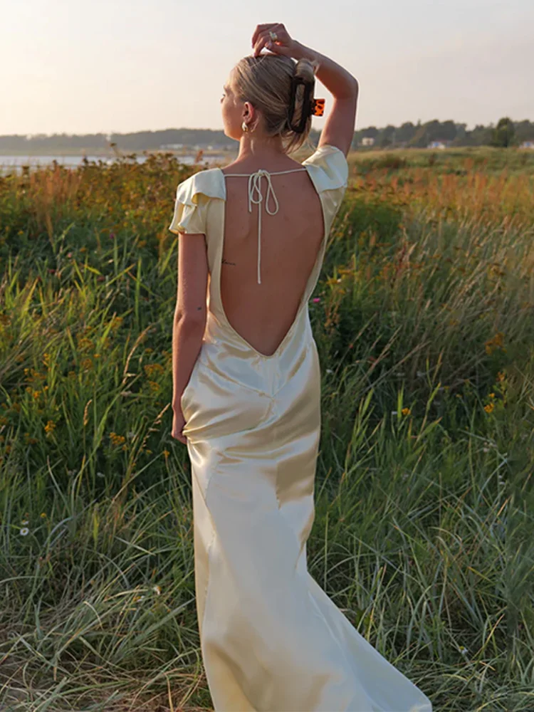 Fashion Solid Satin Backless Maxi Dress Women Chic V-neck Short Sleeve Pleated Dresses 2026 Spring Lady Vacation Street Vestidos
Fashion Solid Satin Backless Maxi Dress Women Chic V-neck Short Sleeve Pleated Dresses 2026 Spring Lady Vacation Street Vestidos