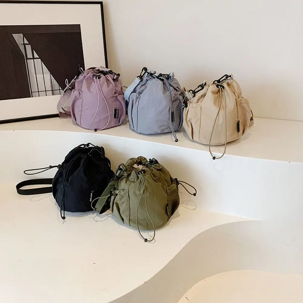 Korean Style Drawstring Bucket Bag Solid Color Wrinkle Nylon Crossbody Bag Adjustable Shoulder Strap Mesh Shoulder Bag Women
Korean Style Drawstring Bucket Bag Solid Color Wrinkle Nylon Crossbody Bag Adjustable Shoulder Strap Mesh Shoulder Bag Women