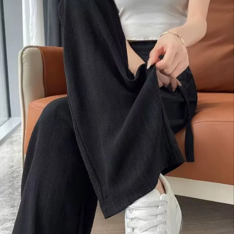 Широкие брюки из ледяного шелка для женщин, новинка 2025 года, повседневные брюки в пол с высокой талией и ленивым стилем на шнурке, летние женские брюки
Широкие брюки из ледяного шелка для женщин, новинка 2025 года, повседневные брюки в пол с высокой талией и ленивым стилем на шнурке, летние женские брюки