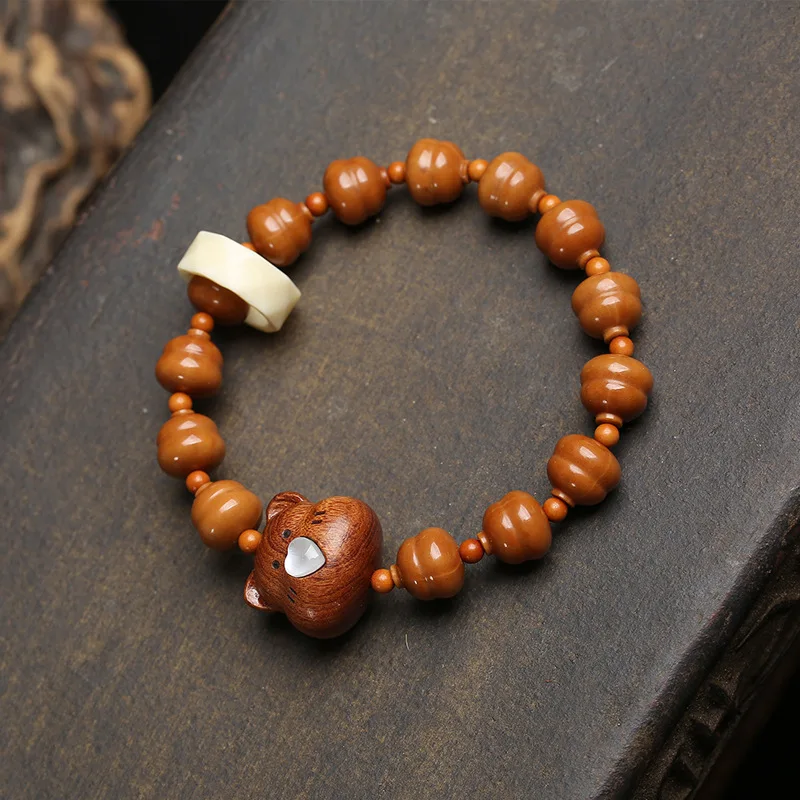 Natural carved gourd, monkey head, and Bodhi wood carvings, handmade beaded bracelet with a single peach
Natural carved gourd, monkey head, and Bodhi wood carvings, handmade beaded bracelet with a single peach