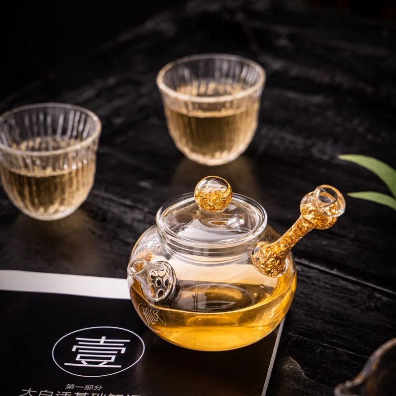 Glass gold foil teapot office side handle tea teapot household heat-resistant kung fu tea set
Glass gold foil teapot office side handle tea teapot household heat-resistant kung fu tea set