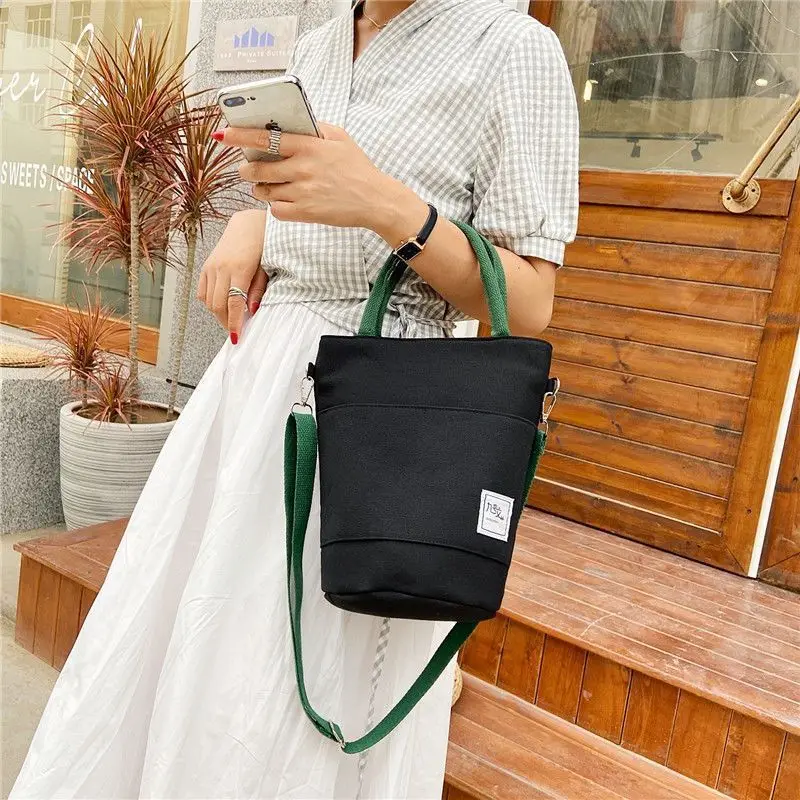 Women's new canvas handheld/crossbody bag, simple and versatile bucket shoulder handbag
Women's new canvas handheld/crossbody bag, simple and versatile bucket shoulder handbag