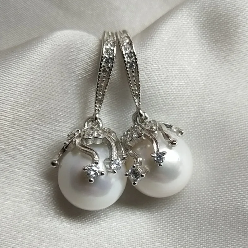 Белые круглые бусины из пресноводного жемчуга практически безупречные серьги из серебряного жемчуга 11-12 мм 925 щедрые
Белые круглые бусины из пресноводного жемчуга практически безупречные серьги из серебряного жемчуга 11-12 мм 925 щедрые