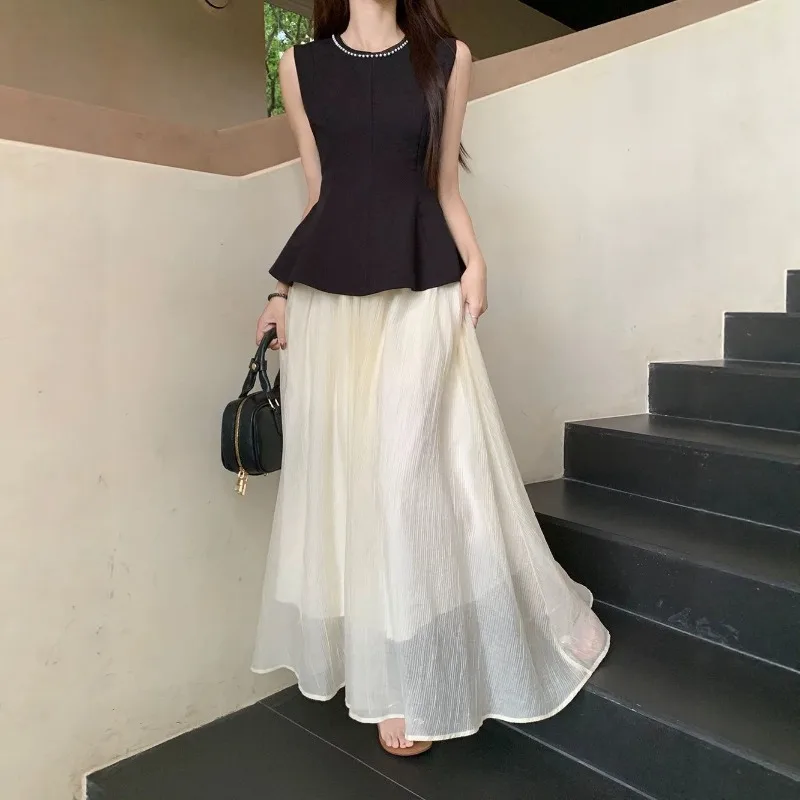 2026 Summer Sleeveless Top and Chiffon Long Skirt Two-piece Set Korean Fashion Women's Elegant Casual Matching Set
2026 Summer Sleeveless Top and Chiffon Long Skirt Two-piece Set Korean Fashion Women's Elegant Casual Matching Set