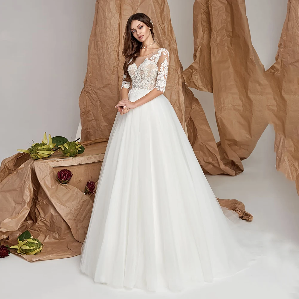 Elegant Princess Tulle Bride Gown For Weddings Half Sleeve Scoop Neck Floor Length Applique Button Back Vintage Bridal Dresses
Elegant Princess Tulle Bride Gown For Weddings Half Sleeve Scoop Neck Floor Length Applique Button Back Vintage Bridal Dresses