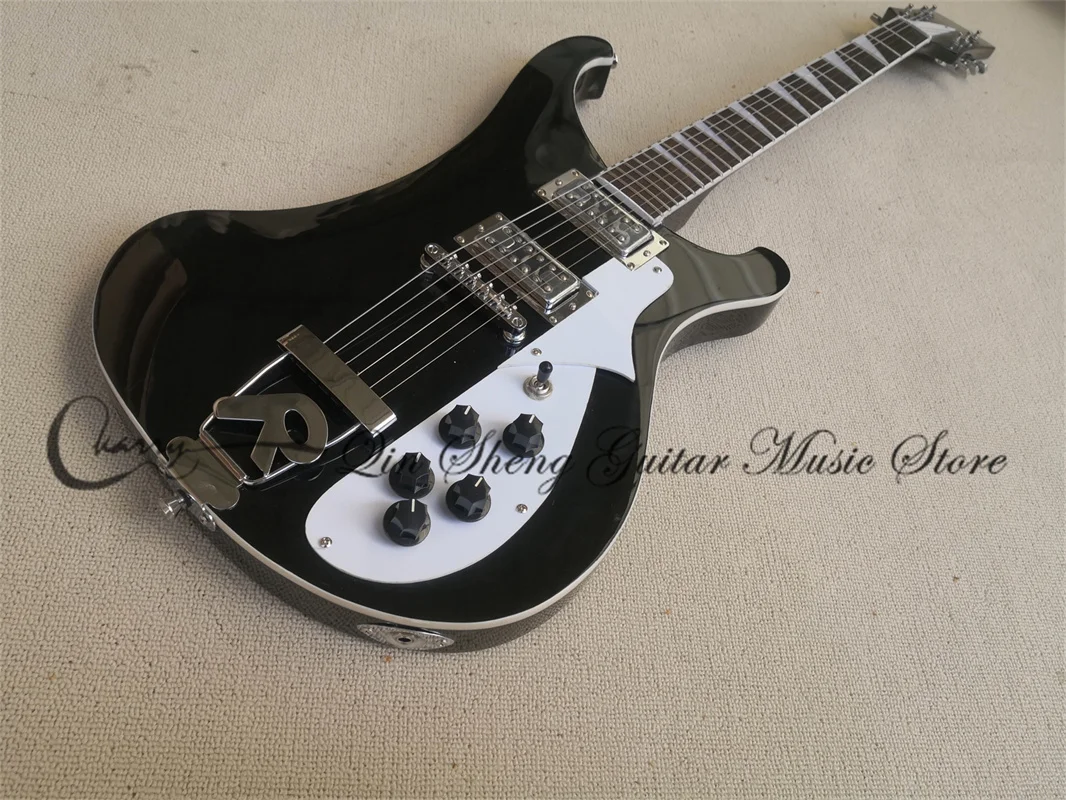 4003 Electric Guitar, Black Guitar, Mahogany Head Set In Body, White Bound, R Tailpiece, Chrome Knob, 5 Electrons,
4003 Electric Guitar, Black Guitar, Mahogany Head Set In Body, White Bound, R Tailpiece, Chrome Knob, 5 Electrons,